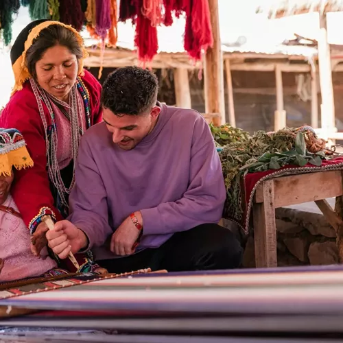 Local artisans demonstrating traditional Andean weaving - Contiki South American Explorer Tour