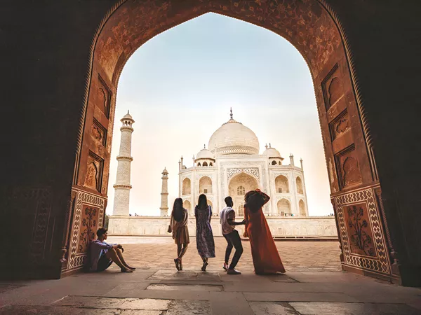 Group Of People Enjoying The View Of A Landmark