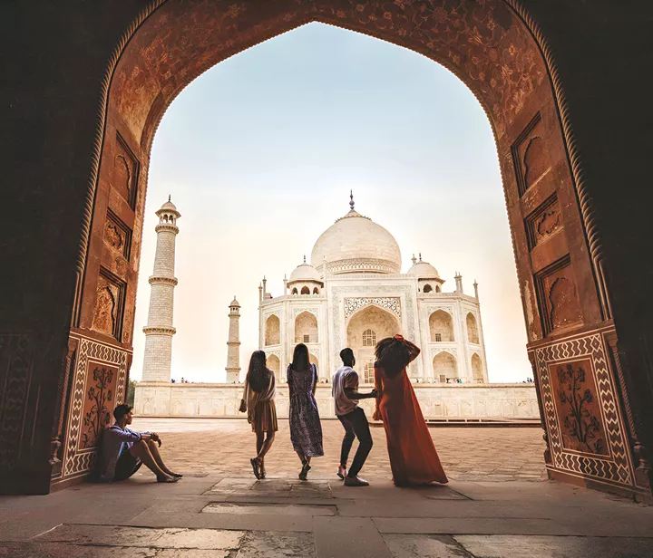 Group Of People Enjoying The View Of A Landmark
