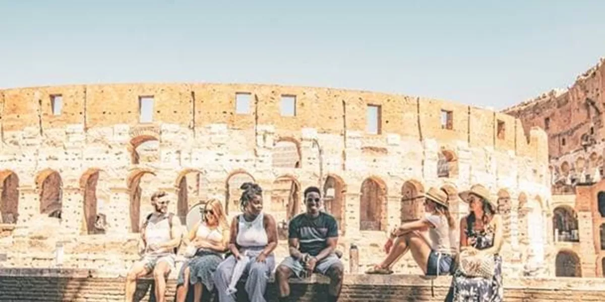 Group of People Sitting in front of Coloseum, Rome