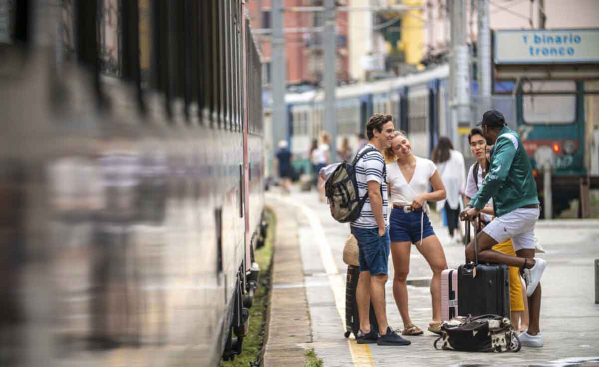 Group Stading At Train Station With Luggage