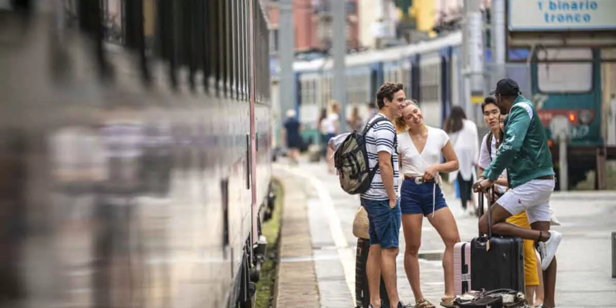 Group Stading At Train Station With Luggage