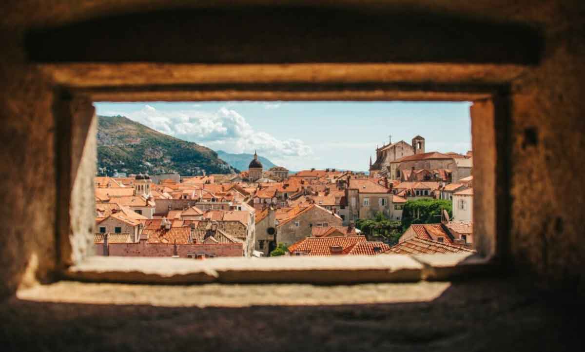 Albanian Houses Shot Through Hole In Building