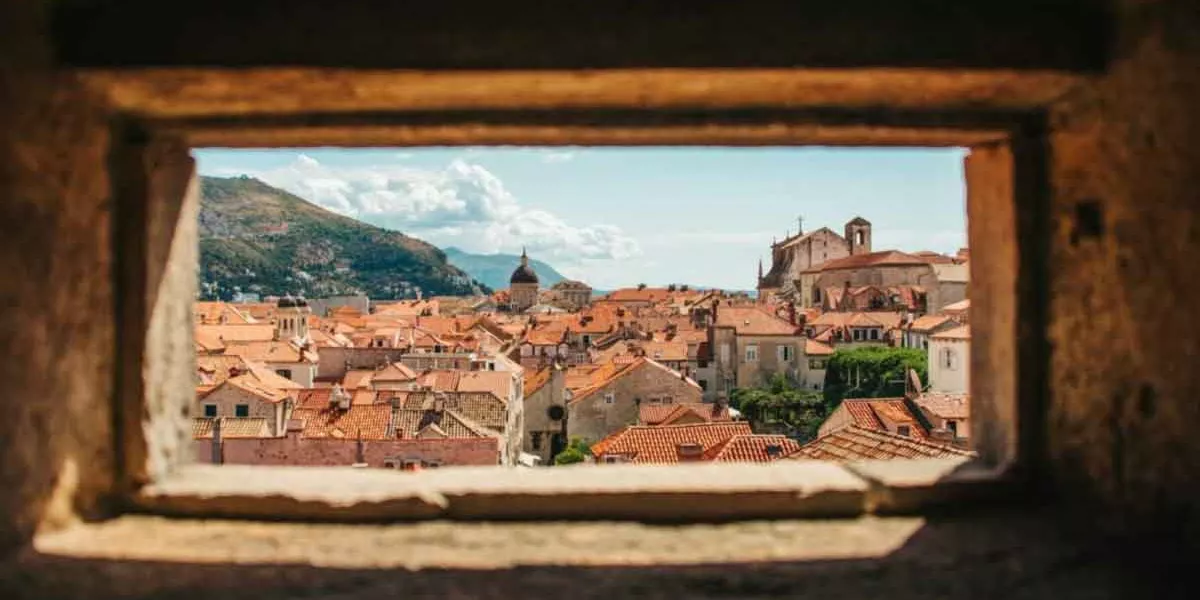 Albanian Houses Shot Through Hole In Building