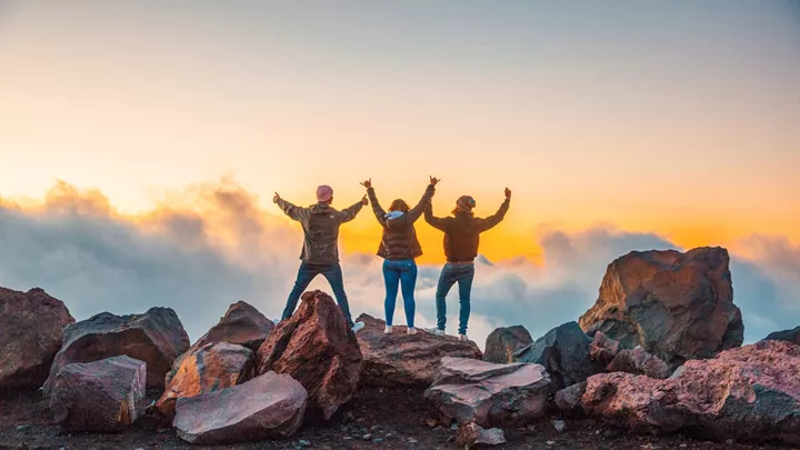 Travellers at the top of Mount Ruapehu during sunset in New Zealand