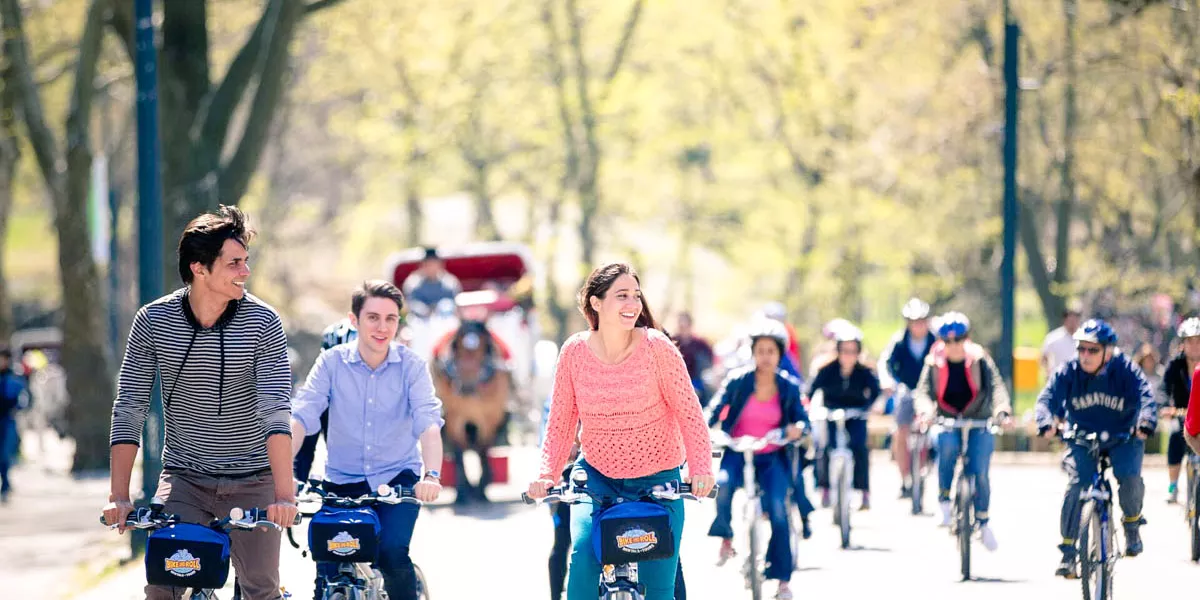 Group Of Young People Riding Bikes