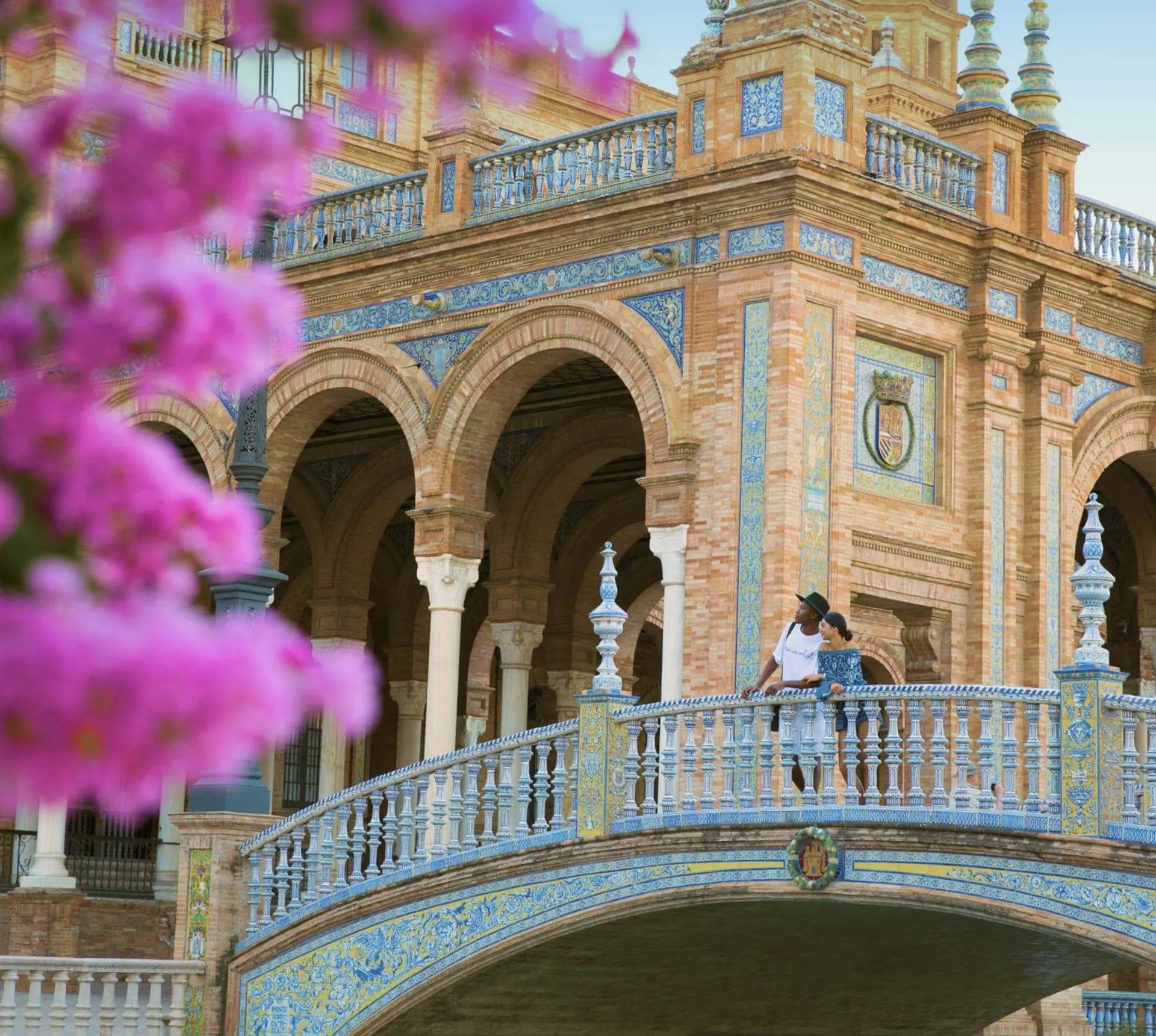 Two people exploring Plaza de España in Seville on Contiki's Madrid to Barcelona Tour in Spain