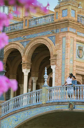 Two people exploring Plaza de España in Seville on Contiki's Madrid to Barcelona Tour in Spain