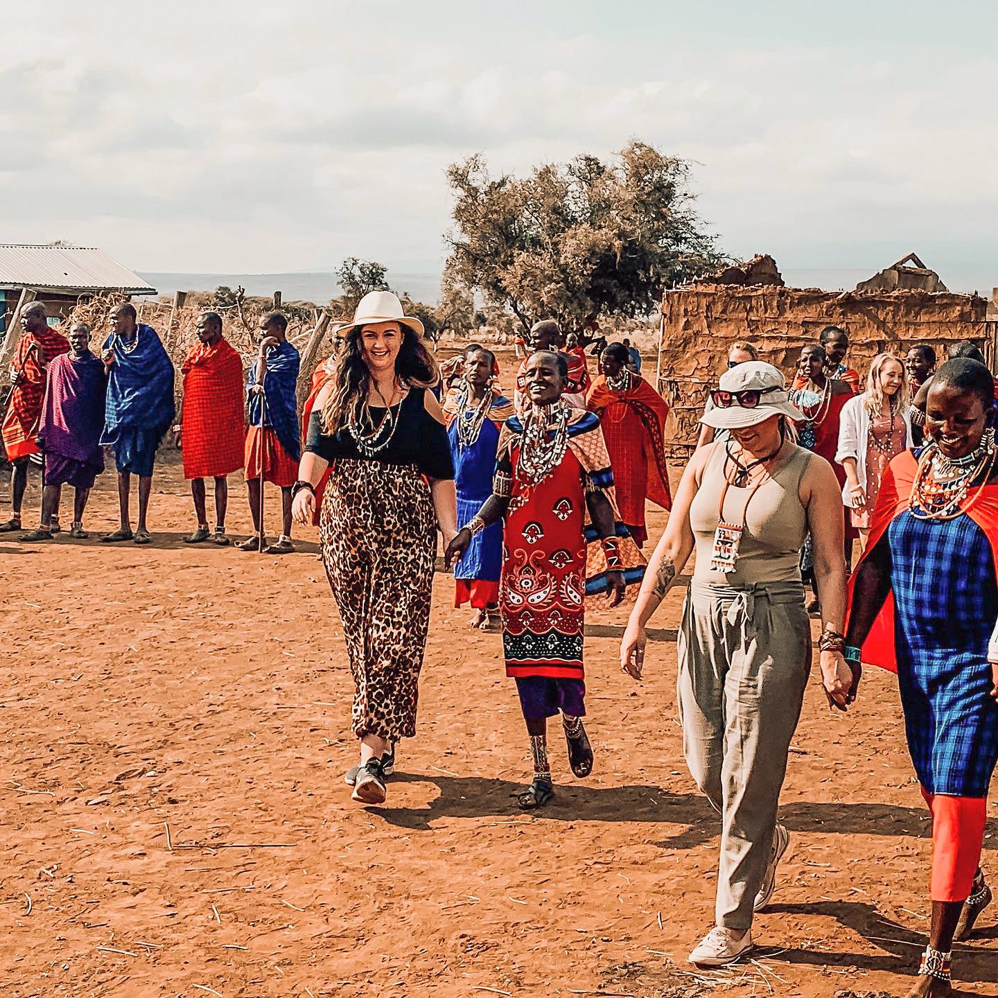 Travellers with locals at Tarangire Village in Tarangi, Tanzania