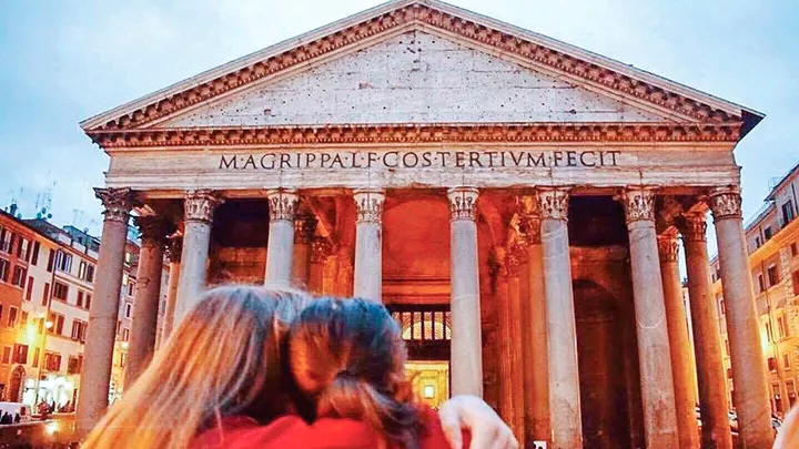 Travellers hugging at the Pantheon in Rome, Italy