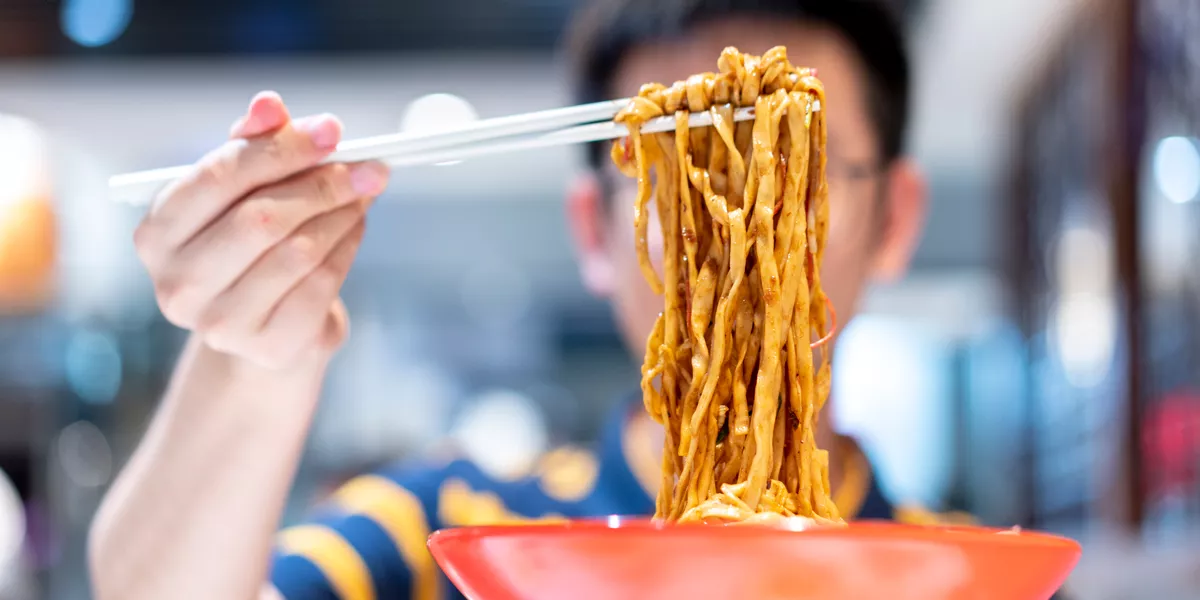 Tasting Noodles In Chinese Market