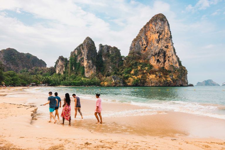 group-walking-on-thai-beach.jpg