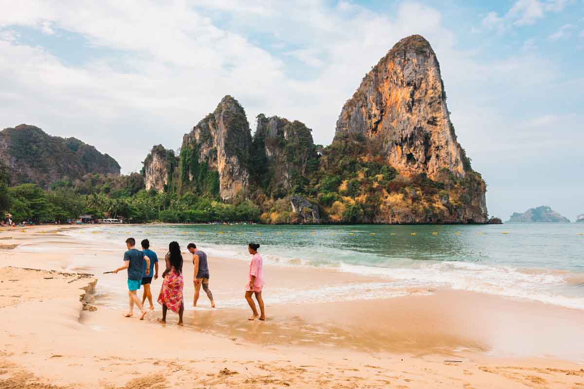 Young People Walking On A Beach In Thailand