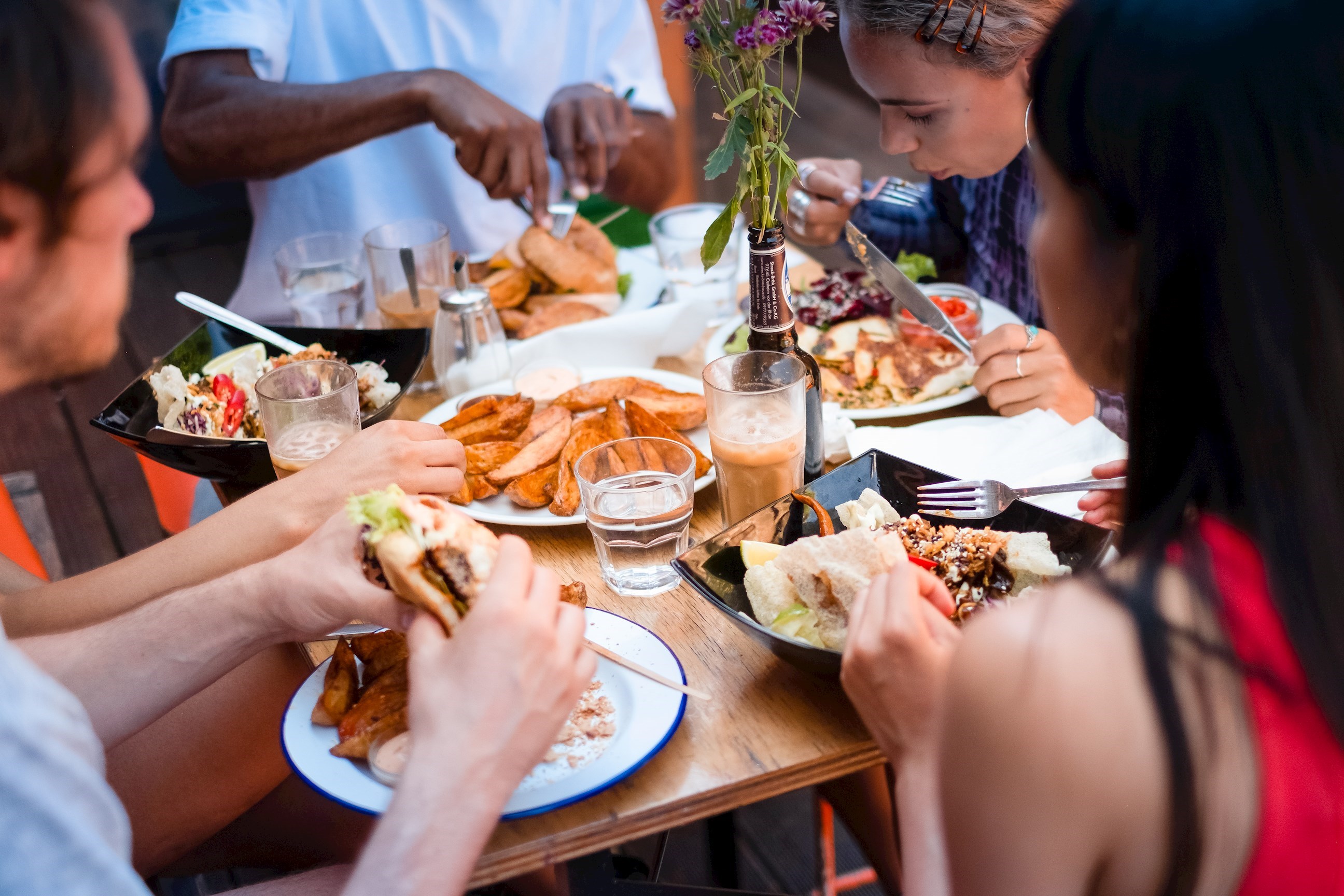 Travelers Tucking into Dinner at Table, Amsterdam, Netherlands