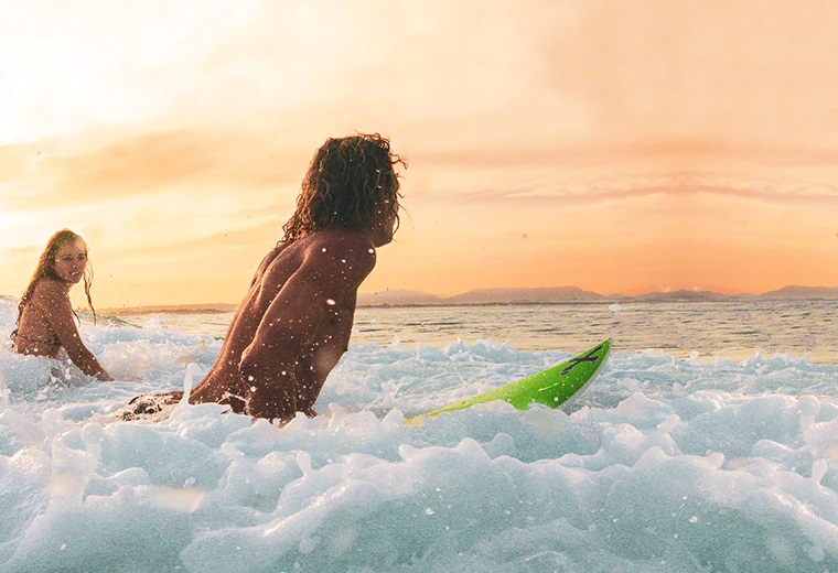 Surfers surfing in Byron Bay, Australia