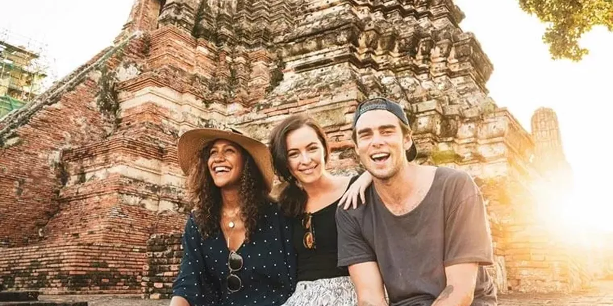 Young People Smilling and Sitting Together