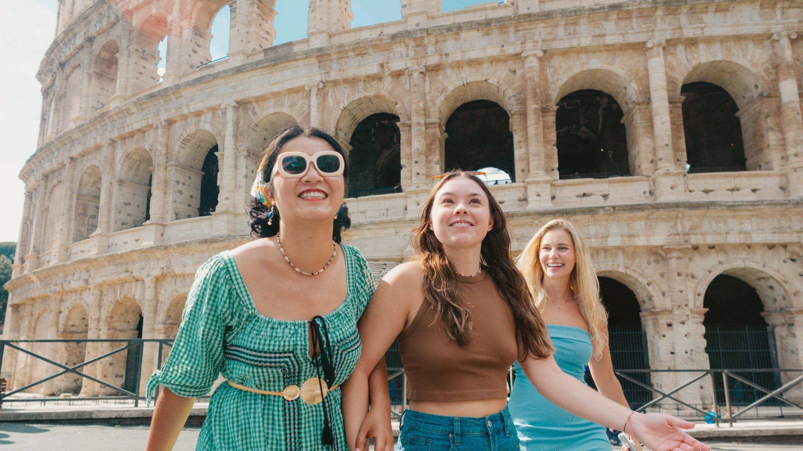Travellers walking past the Colosseum in Rome, Italy - Contiki Rome, Athens & Cairo Tour