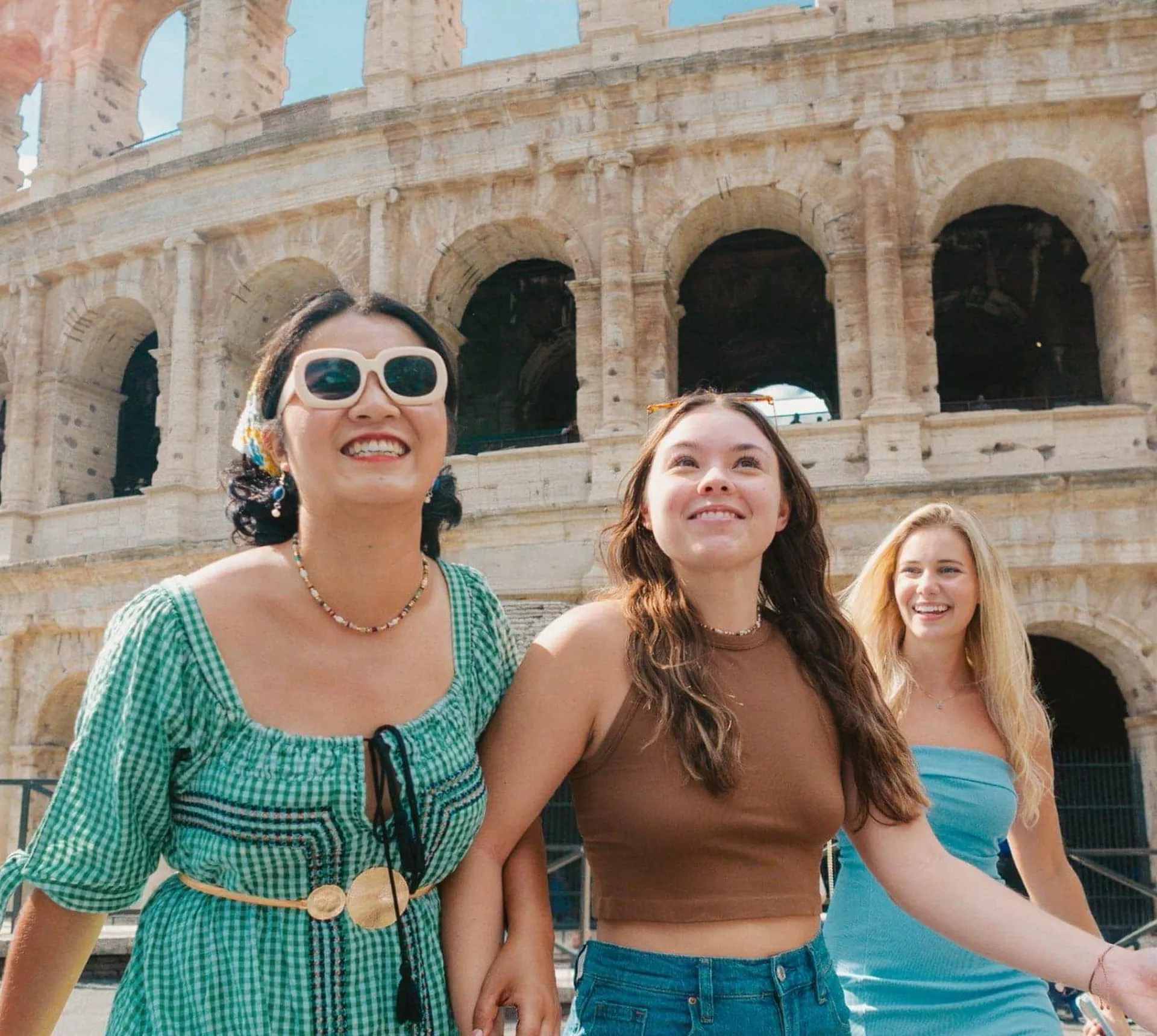 Travellers walking past the Colosseum in Rome, Italy - Contiki Rome, Athens & Cairo Tour