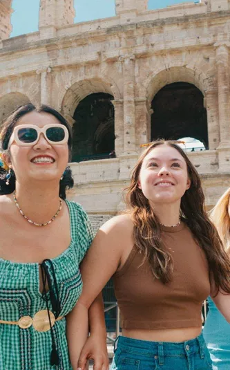 Travellers walking past the Colosseum in Rome, Italy - Contiki Rome, Athens & Cairo Tour