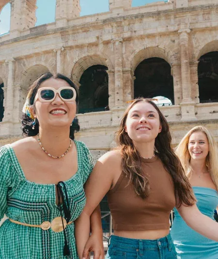 Travellers walking past the Colosseum in Rome, Italy - Contiki Rome, Athens & Cairo Tour