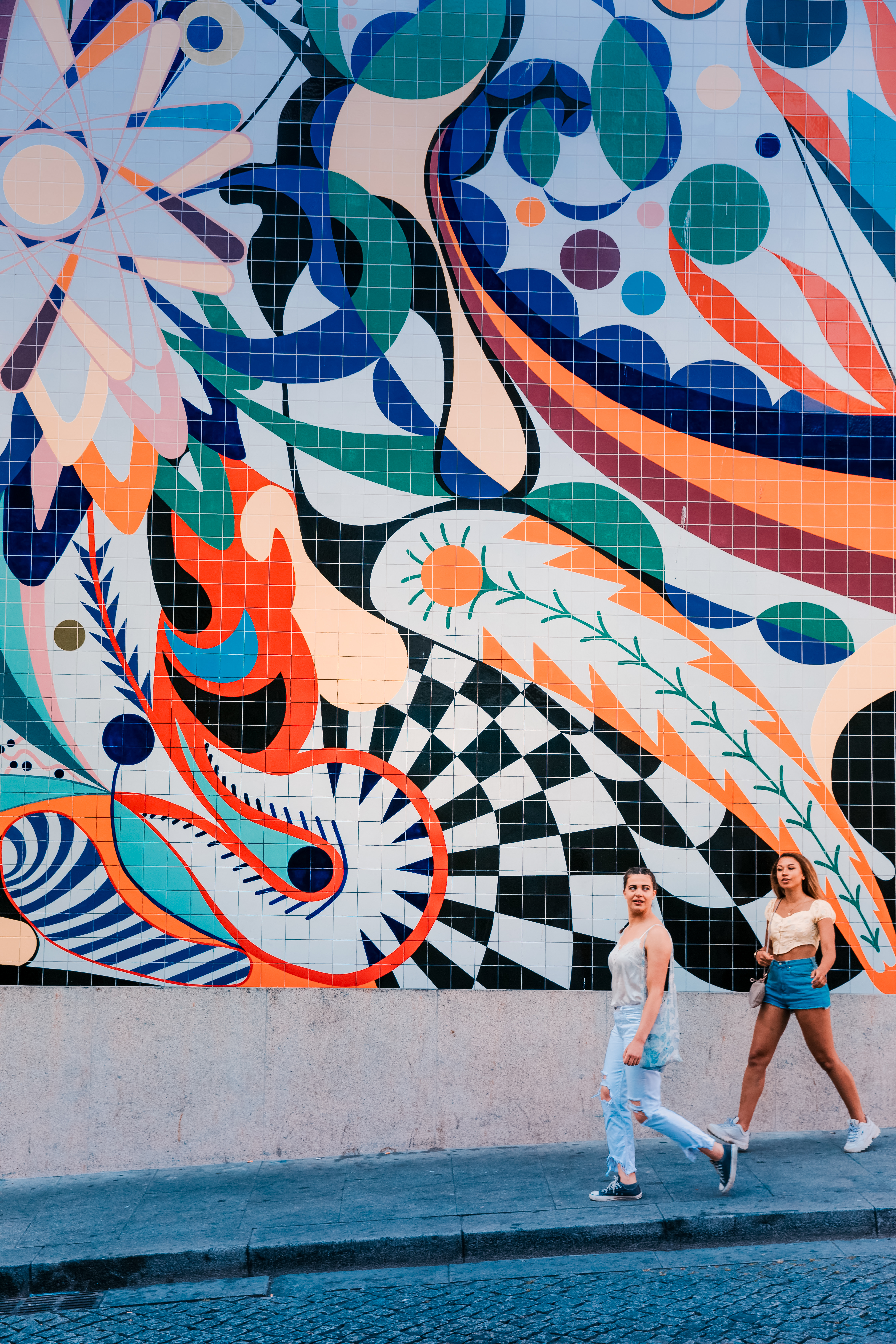 Travellers visiting street art in Portugal
