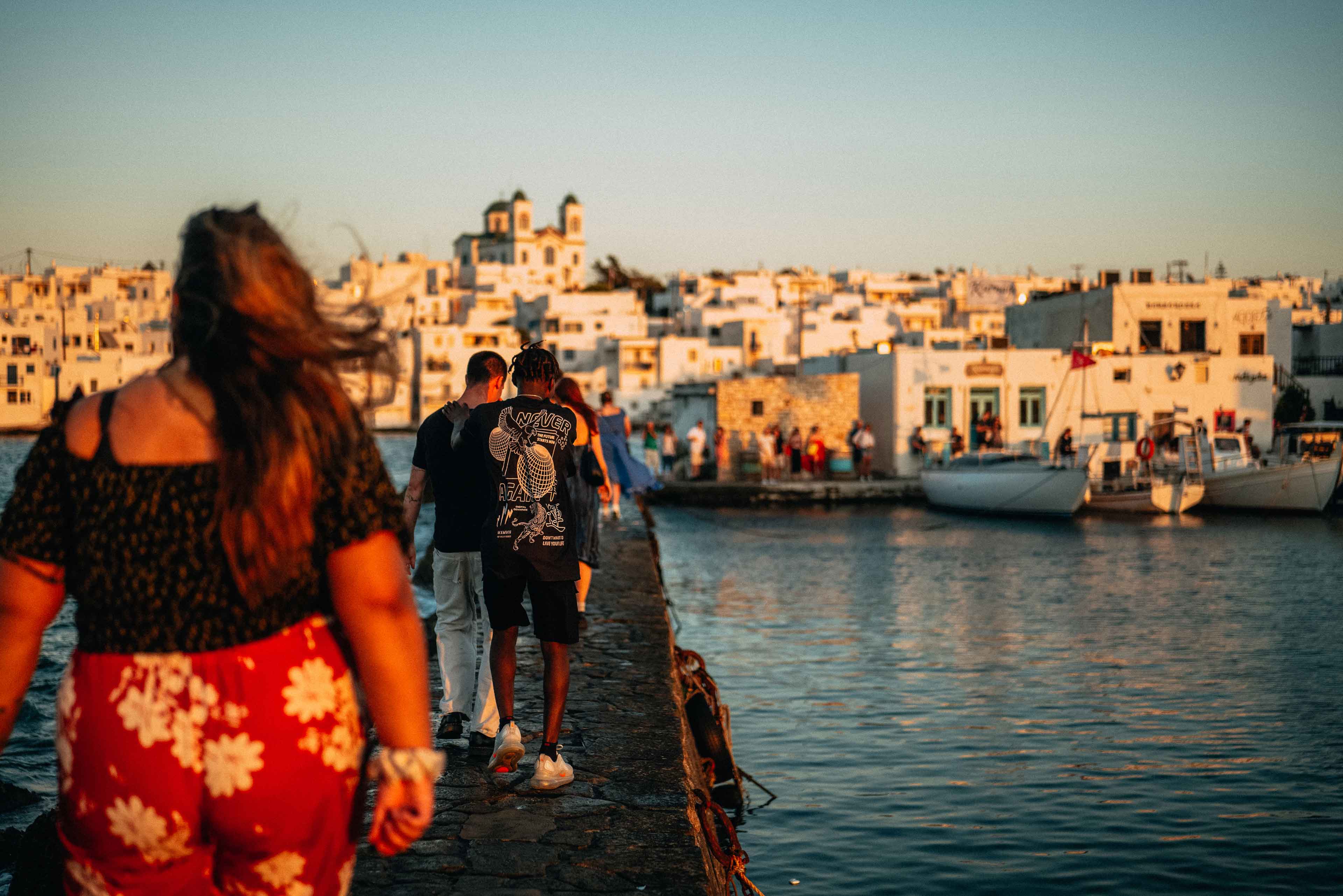 Young Group Of Travelers Exploring Greek Harbour