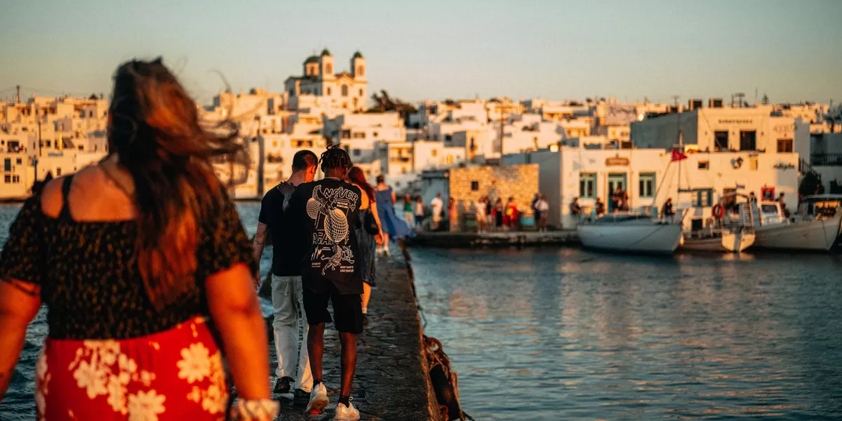 Young Group Of Travelers Exploring Greek Harbour