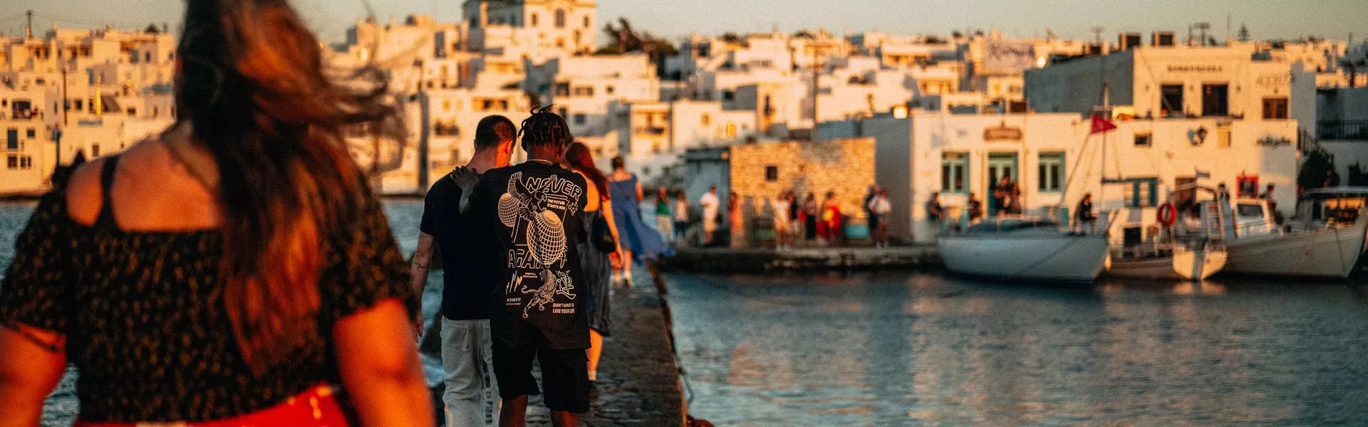 Young Group Of Travelers Exploring Greek Harbour