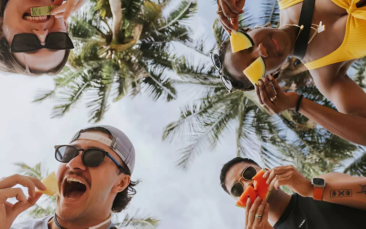 happy-young-people-holding-fruits-and-smiling.jpg