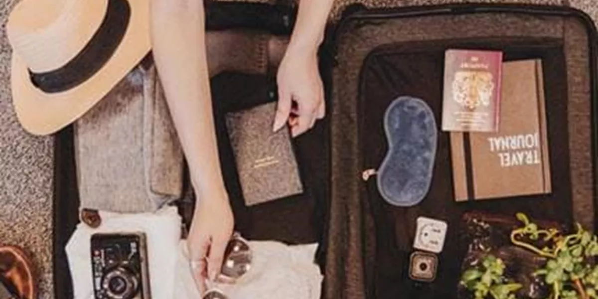 A packed suitcase with travel essentials