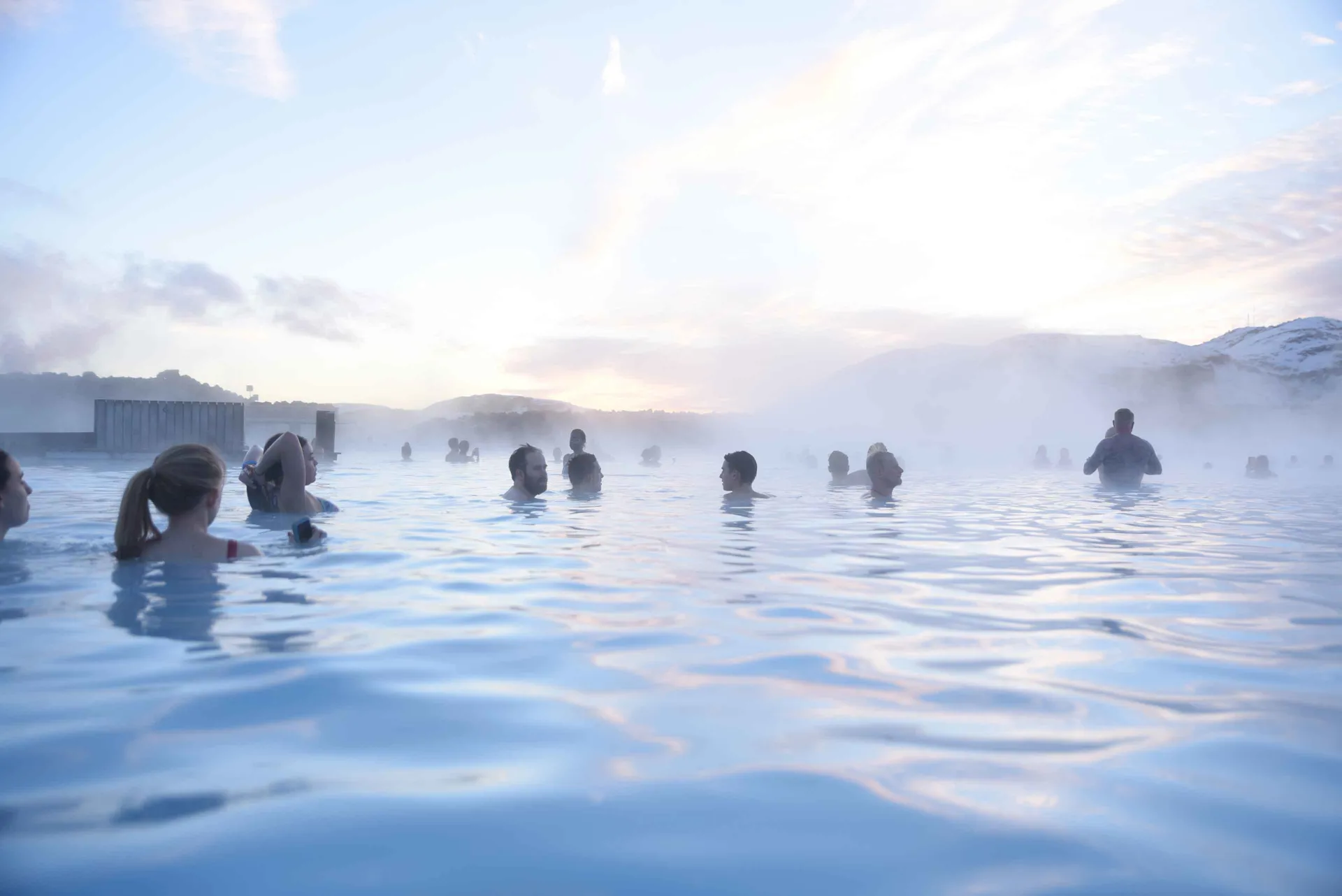 People enjoying a natural spa in Iceland.