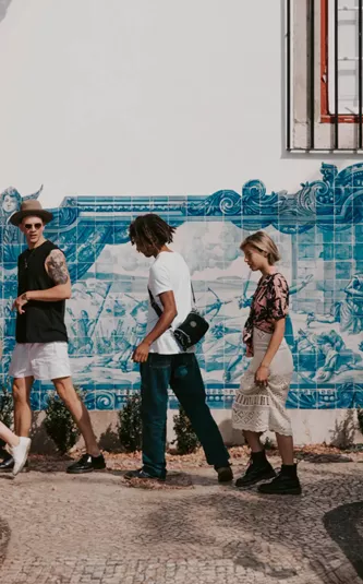 Travellers walking past traditional blue azulejo tiles in Lisbon, Portugal - Contiki Spain, Portugal & Morocco Uncovered Tour