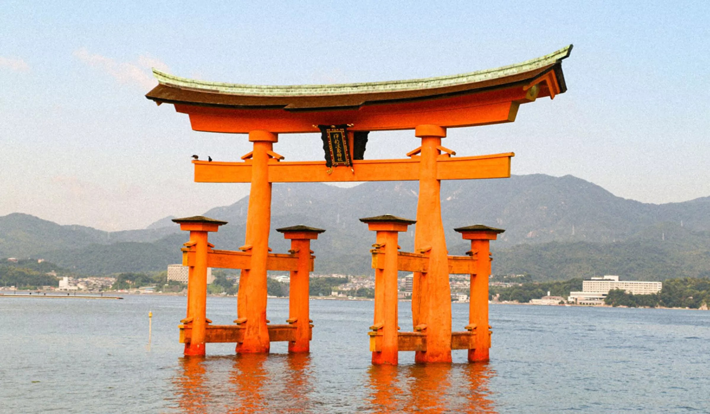A gate architecture landmark in Japan on water.