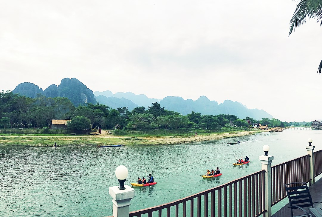 Kayaking by the mountains in Vang Vieng, Laos