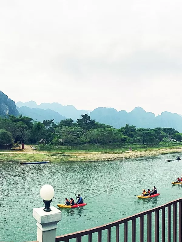 Kayaking by the mountains in Vang Vieng, Laos