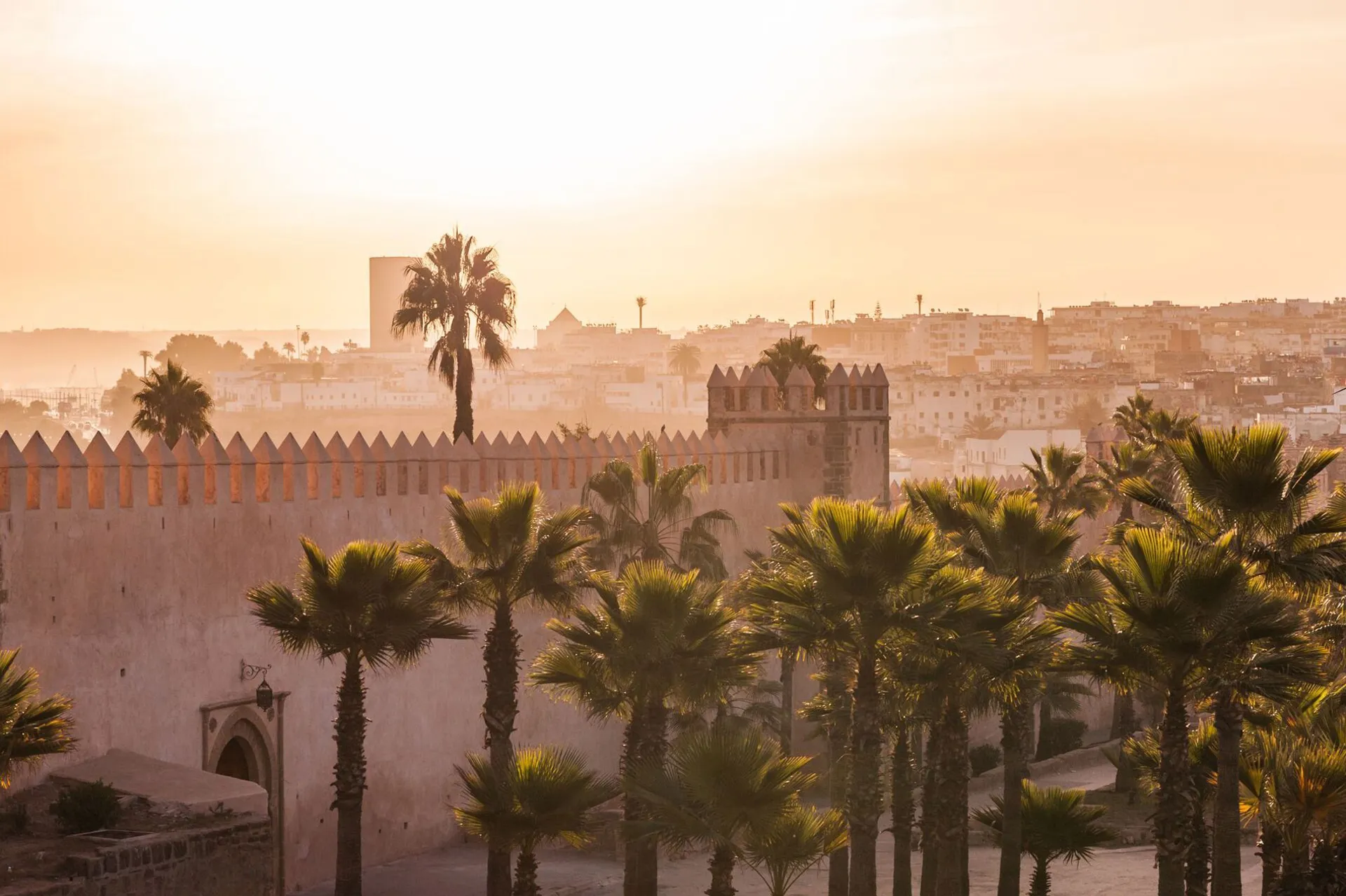 Hazy sunrise over the fortress wall of the kasbah of the udayas in rabat, Morocco