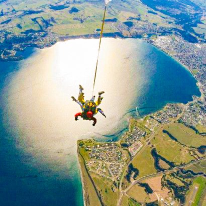 Traveller falling through the sky during their Tandem Skydive over Taupo, New Zealand