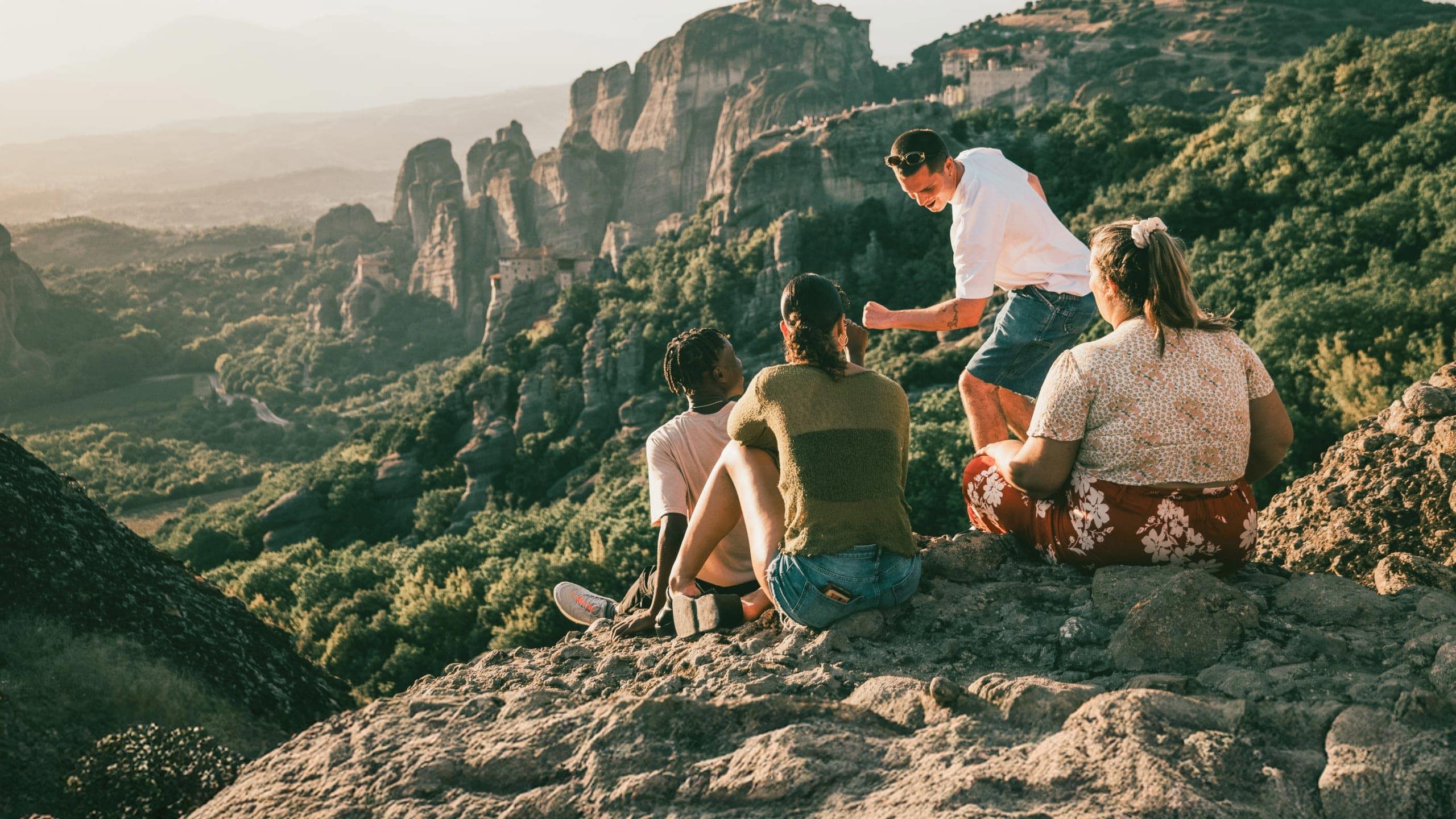 Travellers take in panoramic views of Meteora's cliff-top monasteries during Contiki's Greece: Athens, Delphi & Meteora Tour
