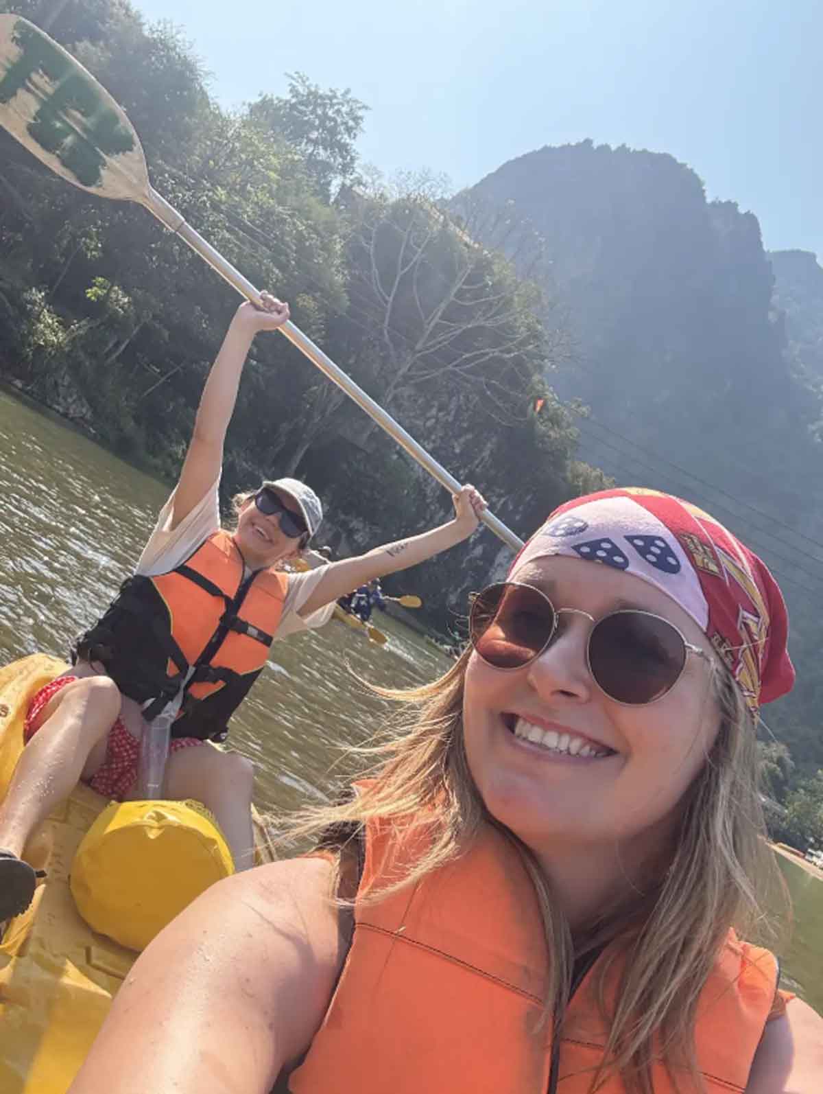 Close Up Of Travelers In River Laos