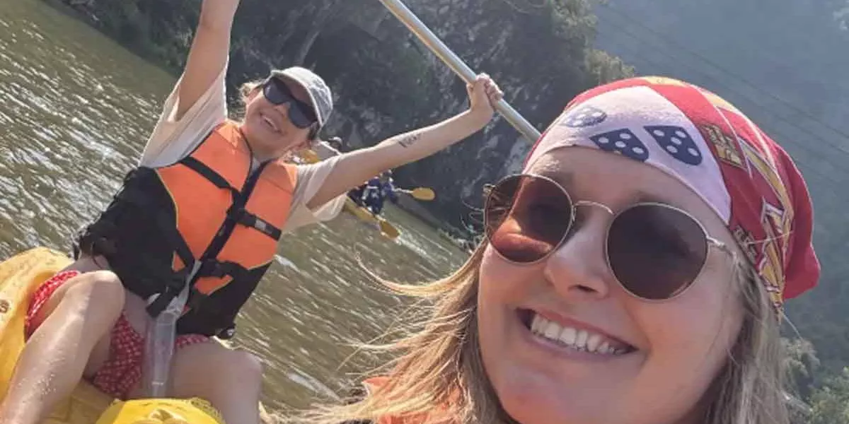 Close Up Of Travelers In River Laos