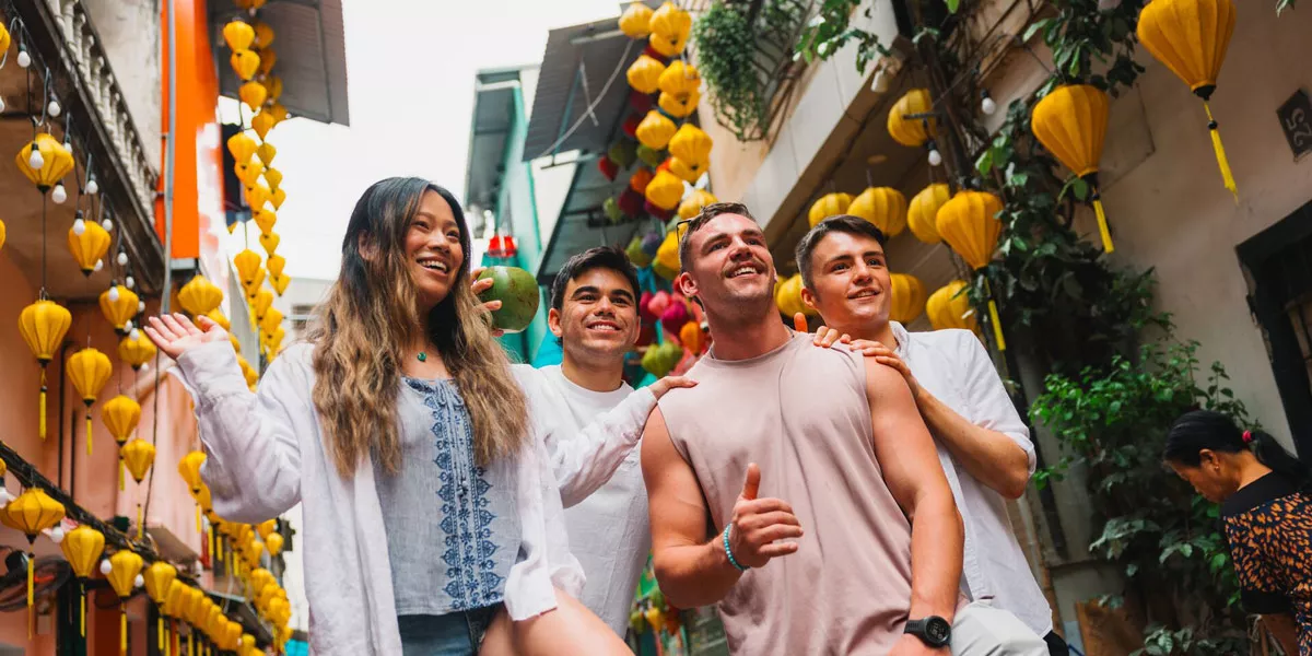Friends Walking In A Busy Road Smiling