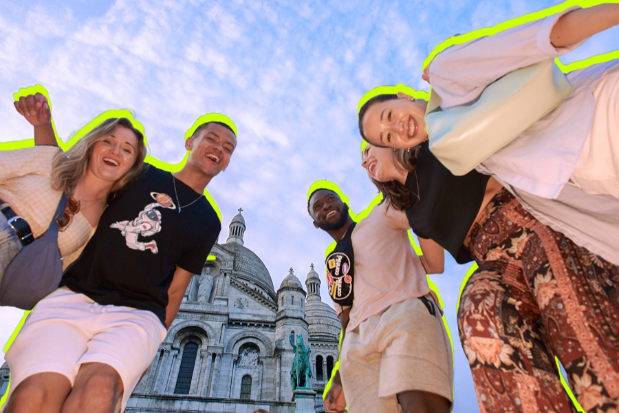 Group of friends are having fun in front of famous church in Europe.