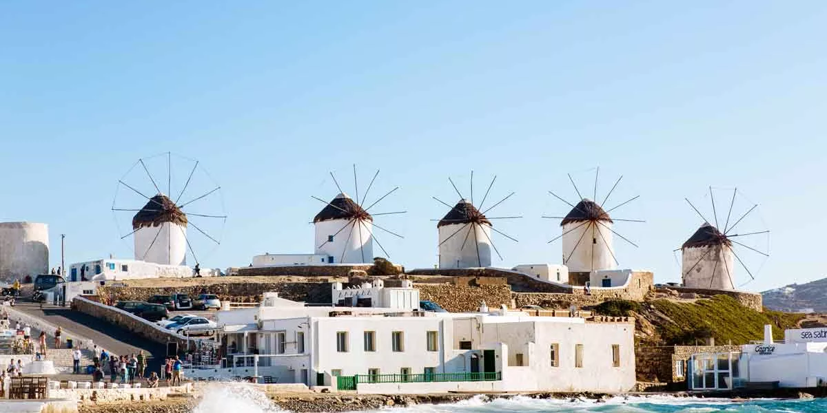 Distant View Of Traditional Windmills On Mykonos Island, Cyclades, Greece