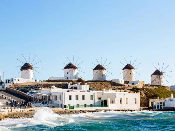 Distant View Of Traditional Windmills On Mykonos Island, Cyclades, Greece