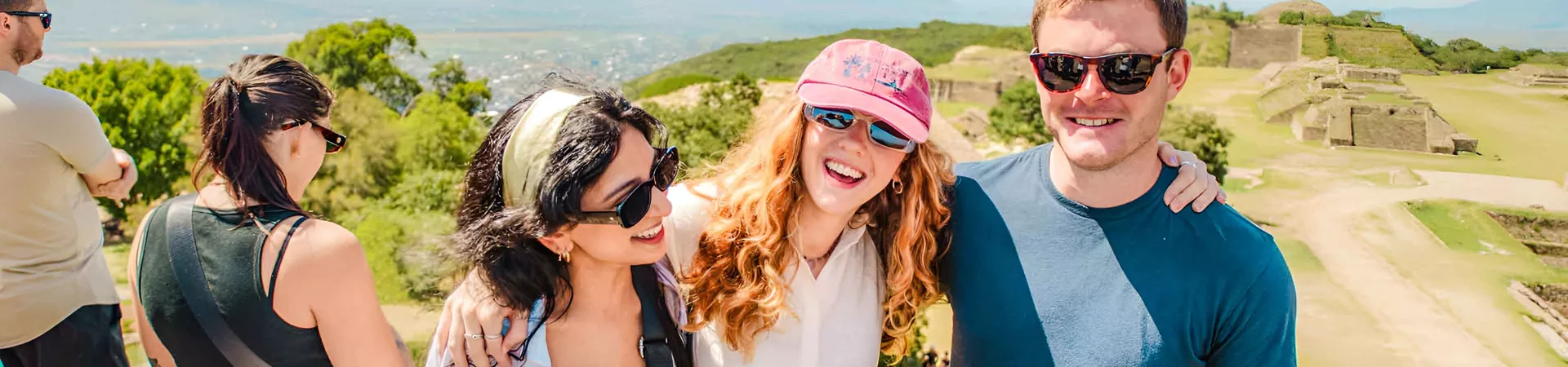 Three Friends Smiling Mexico Landmark At The Background