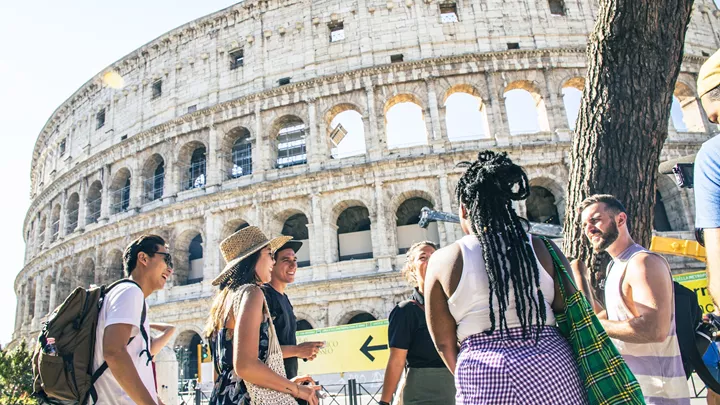 Travellers stood outside the Colosseum in Rome, Italy