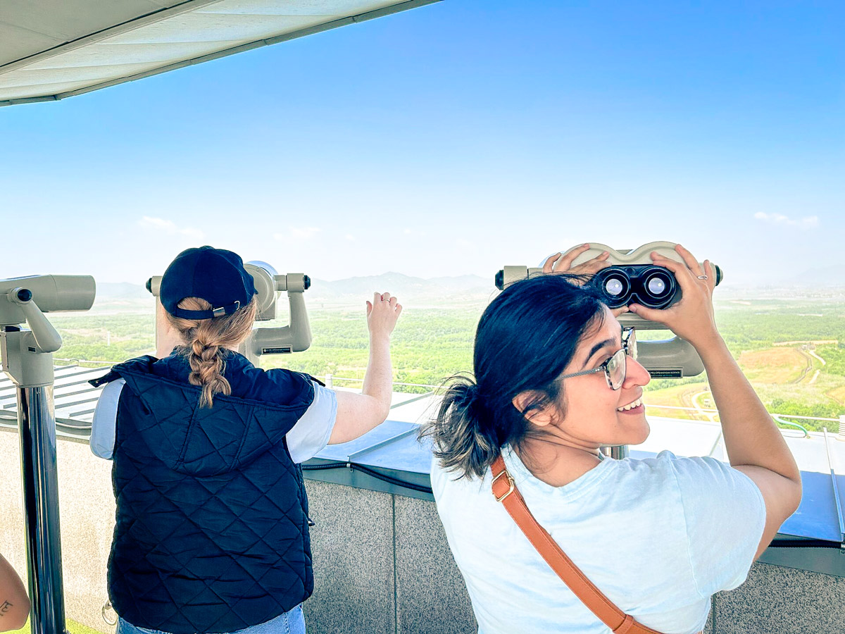 Smiling Woman Observing Landscape