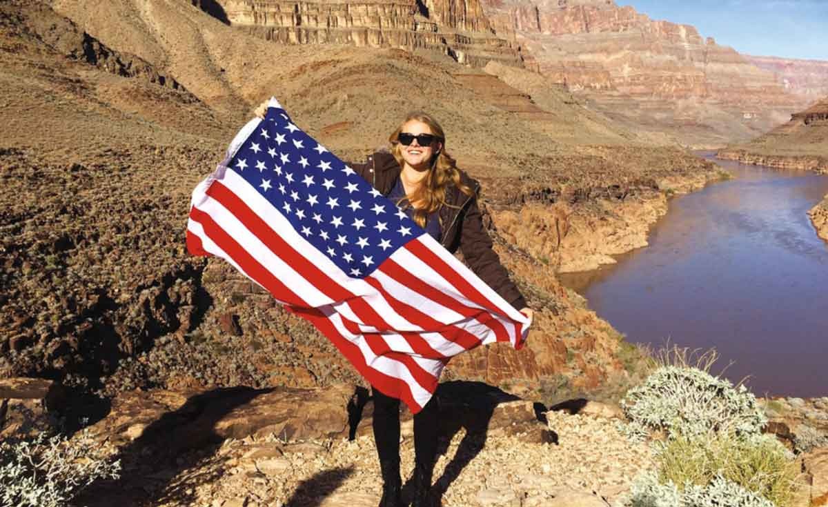 Femal Traveler With Usa Flag