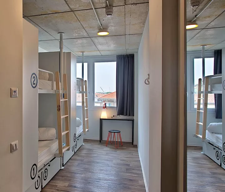 A bedroom with a bunk bed