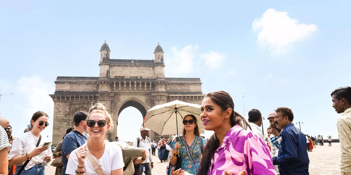 Group Of People Enjoying A Tour Around A City